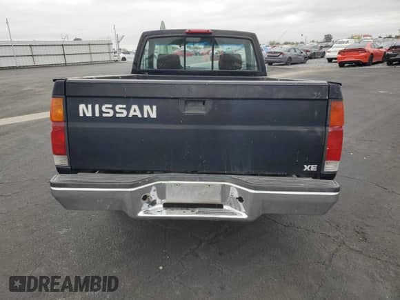 1995 Nissan Frontier z VIN 1N6SD11S5SC335661, wystawiony jako Copart lot #82740855 z przebiegiem 168 579 mil mil oraz Szkoda całkowita • Salvage title. Historia ofert i sprzedaży dostępna na DreamBid. Obrazek 6.
