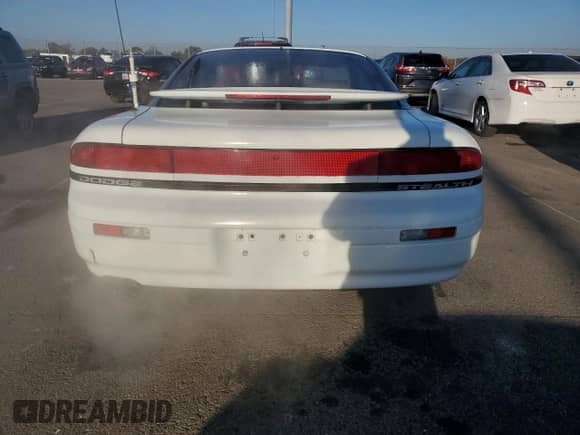 1994 Dodge Stealth with VIN JB3AM44H1RY006874, listed as a Copart auction lot 75991164 with 59,310 mi miles and Salvage title. Bid and sale history available at DreamBid. Image 6.
