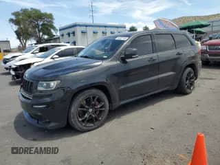 2012 Jeep Grand Cherokee SRT-8 z VIN 1C4RJFDJ8CC328764, wystawiony jako Copart lot #64507145 z przebiegiem 108 178 mil mil oraz Szkoda całkowita • Salvage title. Historia ofert i sprzedaży dostępna na DreamBid. Obrazek 1.