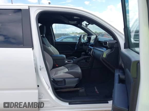 2025 Toyota Tacoma SR with VIN 3TMLB5JN8SM105447, listed as a IAAI auction lot 43487043 with 13,994 mi miles and . Bid and sale history available at DreamBid. Image 5.