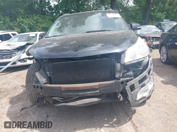 2012 Chevrolet Traverse 2LT z VIN 1GNKRJED8CJ354001, wystawiony jako IAAI lot #42558951 z przebiegiem 293 472 mil mil oraz . Historia ofert i sprzedaży dostępna na DreamBid. Obrazek 13.