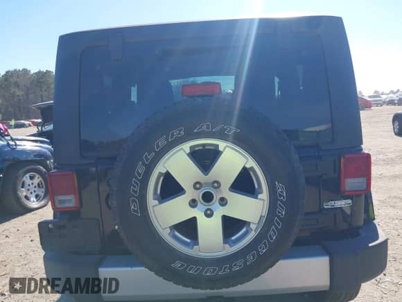 2012 Jeep Wrangler Sahara z VIN 1C4GJWBGXCL104006, wystawiony jako IAAI lot #41470054 z przebiegiem 148 472 mil mil oraz . Historia ofert i sprzedaży dostępna na DreamBid. Obrazek 16.