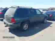 1999 Dodge Durango z VIN 1B4HS28Z7XF522849, wystawiony jako IAAI lot #42678224 z przebiegiem 185 118 mil mil oraz . Historia ofert i sprzedaży dostępna na DreamBid. Obrazek 4.