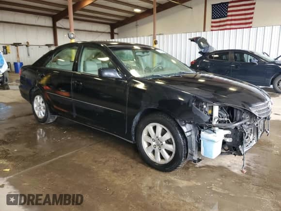 2004 Toyota Camry XLE z VIN 4T1BF30K94U074358, wystawiony jako Copart lot #86265155 z przebiegiem 185 924 mil mil oraz Szkoda całkowita • Salvage title. Historia ofert i sprzedaży dostępna na DreamBid. Obrazek 4.