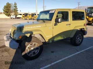 2013 Jeep Wrangler Rubicon with VIN 1C4HJWCG8DL535223, listed as a Copart auction lot 86492615 with 124,963 mi miles and Salvage title. Bid and sale history available at DreamBid. Image 1.