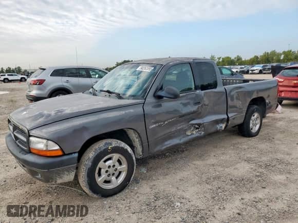 2001 Dodge Dakota z VIN 1B7GL22X91S341785, wystawiony jako Copart lot #90262095 z przebiegiem 164 468 mil mil oraz Szkoda całkowita • Salvage title. Historia ofert i sprzedaży dostępna na DreamBid. Obrazek 1.