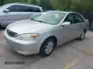 2002 Toyota Camry XLE with VIN 4T1BF30K32U030045, listed as a IAAI auction lot 43025506 with 109,197 mi miles and . Bid and sale history available at DreamBid. Image 2.