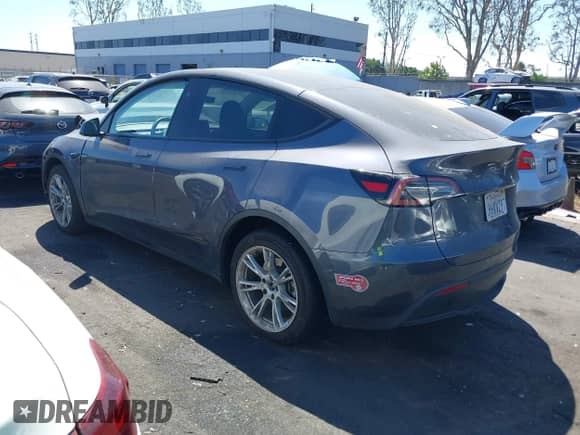 2023 Tesla Model Y Long Range with VIN 7SAYGDEE5PF865572, listed as a IAAI auction lot 43067262 with 56,508 mi miles and . Bid and sale history available at DreamBid. Image 3.