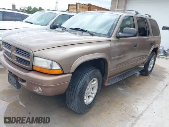 2001 Dodge Durango z VIN 1B4HS28N11F563885, wystawiony jako IAAI lot #43101777 z przebiegiem 149 140 mil mil oraz . Historia ofert i sprzedaży dostępna na DreamBid. Obrazek 2.