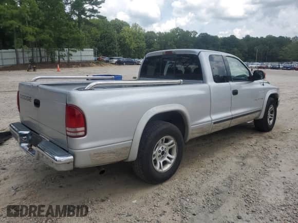 2002 Dodge Dakota SLT с VIN 1B7GL42X32S507859, выставлен на аукционе Copart как лот 66798495 с пробегом 122 591 миль миль и Списание • Salvage title. История ставок и продаж доступна на DreamBid. Изображение 3.