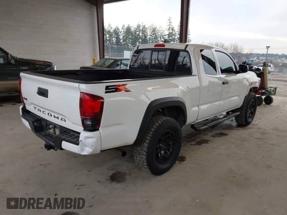 2021 Toyota Tacoma SR with VIN 3TYSZ5AN4MT044869, listed as a IAAI auction lot 41413459 with 62,446 mi miles and . Bid and sale history available at DreamBid. Image 4.