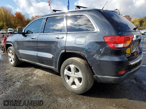 2013 Jeep Grand Cherokee Limited z VIN 1C4RJFBG2DC640359, wystawiony jako Copart lot #86685655 z przebiegiem 150 067 mil mil oraz Szkoda całkowita • Salvage title. Historia ofert i sprzedaży dostępna na DreamBid. Obrazek 2.