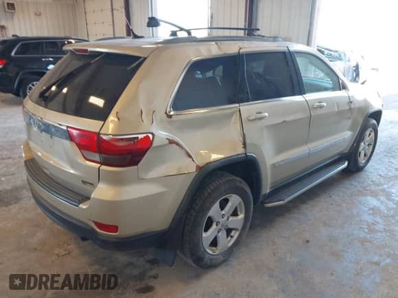 2012 Jeep Grand Cherokee Laredo with VIN 1C4RJFAG8CC153943, listed as a IAAI auction lot 43371764 with 218,266 mi miles and . Bid and sale history available at DreamBid. Image 4.