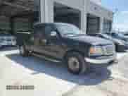 2002 Ford F-150 XLT с VIN 1FTRW07L22KB04146, выставлен на аукционе Copart как лот 69320515 с пробегом 189 839 миль миль и Списание • Salvage title. История ставок и продаж доступна на DreamBid. Изображение 4.