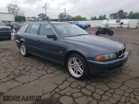 2001 BMW 5 Series 525i with VIN WBADS43441GD84598, listed as a Copart auction lot 63105485 with 205,708 mi miles and Salvage title. Bid and sale history available at DreamBid. Image 4.