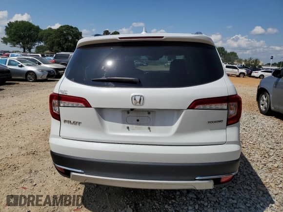 2020 Honda Pilot Touring 8-Passenger z VIN 5FNYF5H94LB011994, wystawiony jako Copart lot #56168045 z przebiegiem 91 737 mil mil oraz Szkoda całkowita • Salvage title. Historia ofert i sprzedaży dostępna na DreamBid. Obrazek 6.