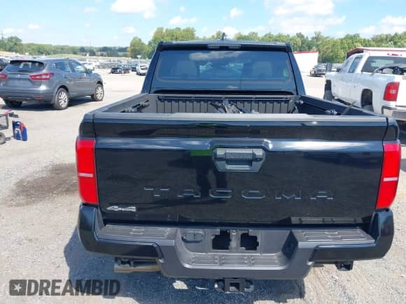2024 Toyota Tacoma SR5 with VIN 3TMLB5JN7RM077957, listed as a IAAI auction lot 43149381 with 11,806 mi miles and . Bid and sale history available at DreamBid. Image 16.