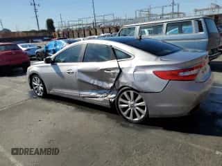 2013 Hyundai Azera z VIN KMHFH4JGXDA245194, wystawiony jako Copart lot #77252934 z przebiegiem 128 712 mil mil oraz Czysty tytuł • Clean title. Historia ofert i sprzedaży dostępna na DreamBid. Obrazek 2.