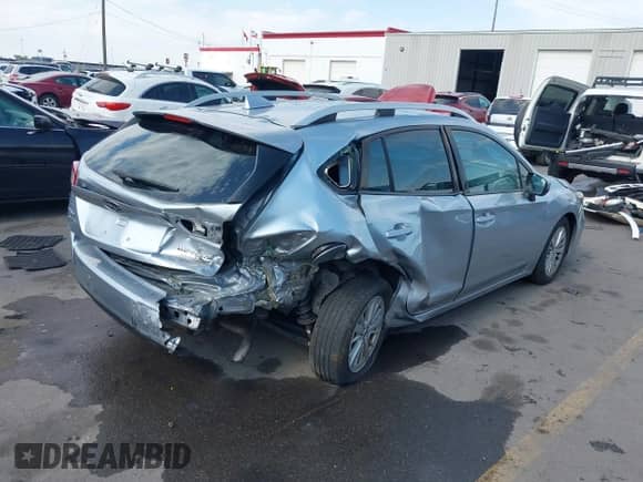 2017 Subaru Impreza Premium with VIN 4S3GTAB6XH3719327, listed as a IAAI auction lot 42642944 with 106,350 mi miles and . Bid and sale history available at DreamBid. Image 4.