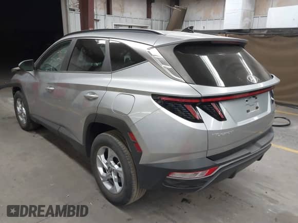 2022 Hyundai Tucson SEL with VIN 5NMJBCAEXNH048557, listed as a IAAI auction lot 43398311 with 19,872 mi miles and . Bid and sale history available at DreamBid. Image 3.