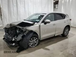 2025 Mazda CX-5 S Select z VIN JM3KFBBLXS0690411, wystawiony jako Copart lot #90328315 z przebiegiem Nie podano mil oraz Szkoda całkowita • Salvage title. Historia ofert i sprzedaży dostępna na DreamBid. Obrazek 1.