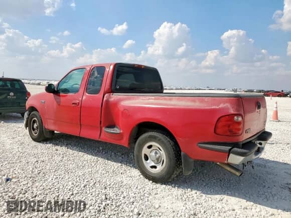 2000 Ford F-150 XL with VIN 1FTRX07WXYKB39193, listed as a Copart auction lot 85164785 with 296,921 mi miles and Salvage title. Bid and sale history available at DreamBid. Image 2.
