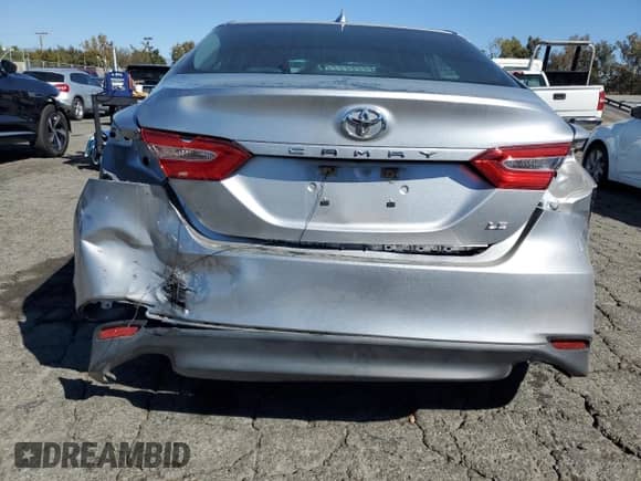 2019 Toyota Camry LE с VIN 4T1B11HKXKU821888, выставлен на аукционе Copart как лот 86159375 с пробегом 64 469 миль миль и Списание • Salvage title. История ставок и продаж доступна на DreamBid. Изображение 6.