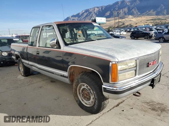 1992 GMC Sierra 1500 z VIN 2GTEK19K0N1519801, wystawiony jako Copart lot #76756064 z przebiegiem 325 350 mil mil oraz Czysty tytuł • Clean title. Historia ofert i sprzedaży dostępna na DreamBid. Obrazek 4.