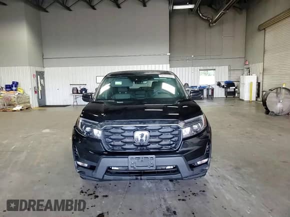 2023 Honda Passport EX-L with VIN 5FNYF8H54PB022207, listed as a Copart auction lot 64393685 with 59,327 mi miles and Salvage title. Bid and sale history available at DreamBid. Image 15.