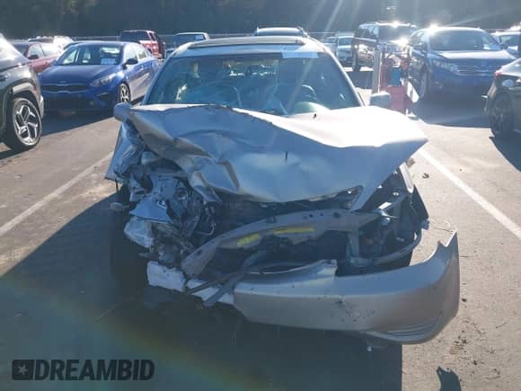 2002 Toyota Camry LE z VIN 4T1BF30K12U540118, wystawiony jako IAAI lot #43395483 z przebiegiem Nie podano mil oraz . Historia ofert i sprzedaży dostępna na DreamBid. Obrazek 13.