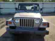 2000 Jeep Wrangler SE with VIN 1J4FA29P4YP775935, listed as a Copart auction lot 80458955 with 100,211 mi miles and Salvage title. Bid and sale history available at DreamBid. Image 5.