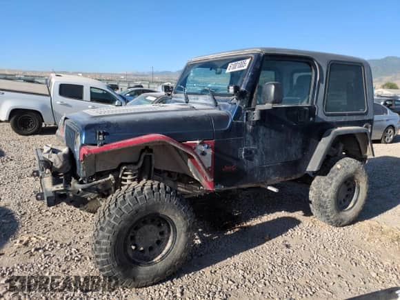 2003 Jeep Wrangler X z VIN 1J4FA39S53P341414, wystawiony jako Copart lot #61001005 z przebiegiem 100 676 mil mil oraz Szkoda całkowita • Salvage title. Historia ofert i sprzedaży dostępna na DreamBid. Obrazek 1.