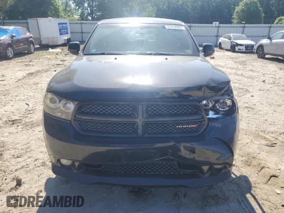 2013 Dodge Durango R/T with VIN 1C4SDHCTXDC677398, listed as a Copart auction lot 57418955 with 61,742 mi miles and Salvage title. Bid and sale history available at DreamBid. Image 5.