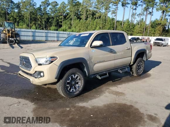 2018 Toyota Tacoma SR with VIN 3TMCZ5AN3JM150306, listed as a Copart auction lot 83791375 with 121,988 mi miles and Salvage title. Bid and sale history available at DreamBid. Image 1.