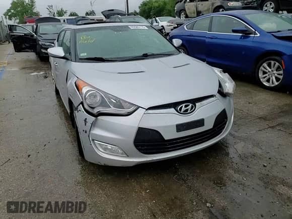 2012 Hyundai Veloster w/Red Int с VIN KMHTC6ADXCU022959, выставлен на аукционе Copart как лот 65585115 с пробегом Не указан миль и Списание • Salvage title. История ставок и продаж доступна на DreamBid. Изображение 13.