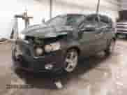 2014 Chevrolet Sonic LTZ with VIN 1G1JE6SB2E4130099, listed as a IAAI auction lot 41568613 with 133,572 mi miles and . Bid and sale history available at DreamBid. Image 2.