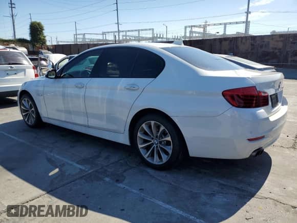 2015 BMW 5 Series 528i with VIN WBA5A5C53FD516858, listed as a Copart auction lot 64005625 with 130,283 mi miles and Salvage title. Bid and sale history available at DreamBid. Image 2.