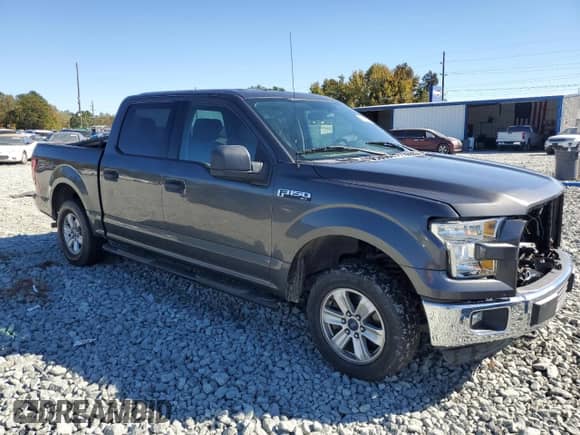 2015 Ford F-150 XLT with VIN 1FTEW1E8XFFB98469, listed as a Copart auction lot 82571545 with 166,986 mi miles and Salvage title. Bid and sale history available at DreamBid. Image 4.