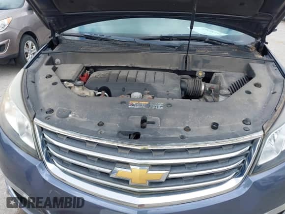 2013 Chevrolet Traverse LT z VIN 1GNKRGKD5DJ178629, wystawiony jako IAAI lot #42838354 z przebiegiem 181 140 mil mil oraz . Historia ofert i sprzedaży dostępna na DreamBid. Obrazek 10.