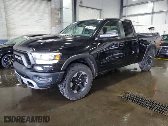 2019 Ram 1500 Rebel z VIN 1C6SRFET7KN746866, wystawiony jako Copart lot #70141445 z przebiegiem 67 389 mil mil oraz Szkoda całkowita • Salvage title. Historia ofert i sprzedaży dostępna na DreamBid. Obrazek 1.