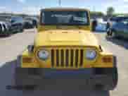 2000 Jeep Wrangler Sport z VIN 1J4FA49S0YP763894, wystawiony jako Copart lot #83925635 z przebiegiem 205 752 mil mil oraz Czysty tytuł • Clean title. Historia ofert i sprzedaży dostępna na DreamBid. Obrazek 5.