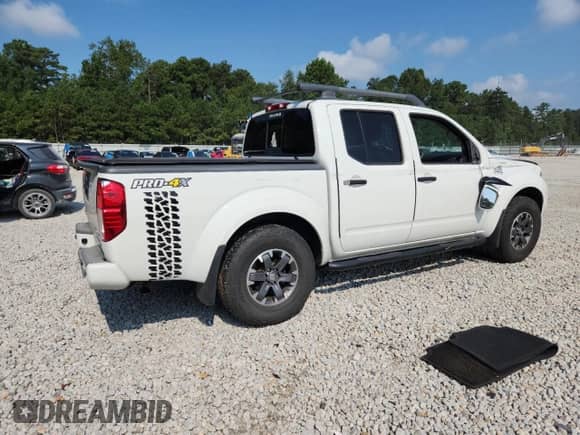 2017 Nissan Frontier Pro-4X with VIN 1N6DD0EV1HN717674, listed as a Copart auction lot 69540635 with 92,630 mi miles and Salvage title. Bid and sale history available at DreamBid. Image 3.