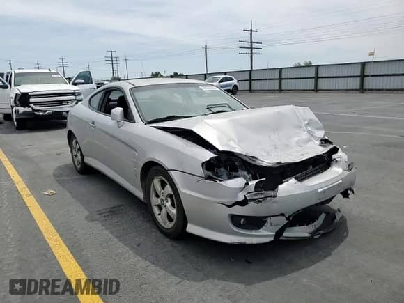 2006 Hyundai Tiburon GS с VIN KMHHM65D86U212227, выставлен на аукционе Copart как лот 59633855 с пробегом Не указан миль и Списание • Salvage title. История ставок и продаж доступна на DreamBid. Изображение 13.