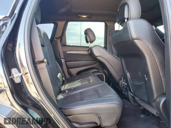 2014 Jeep Grand Cherokee Summit with VIN 1C4RJFJTXEC127795, listed as a Copart auction lot 58586945 with 124,181 mi miles and Salvage title. Bid and sale history available at DreamBid. Image 11.