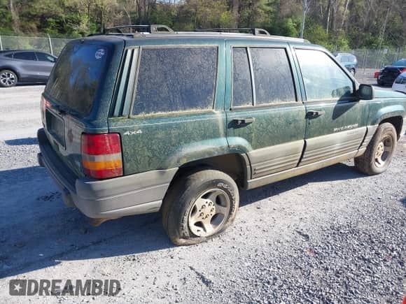 1996 Jeep Grand Cherokee with VIN 1J4EZ58Y7TC128428, listed as a IAAI auction lot 42050443 with 241,591 mi miles and . Bid and sale history available at DreamBid. Image 4.