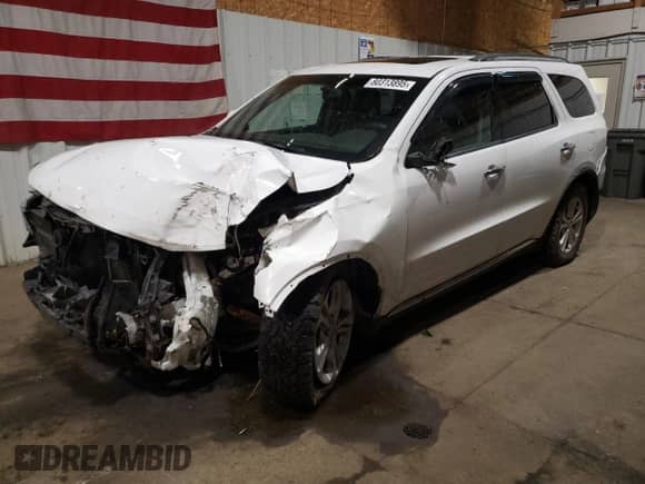 2013 Dodge Durango Crew with VIN 1C4RDJDG9DC554196, listed as a Copart auction lot 80313895 with 104,486 mi miles and Salvage title. Bid and sale history available at DreamBid. Image 1.