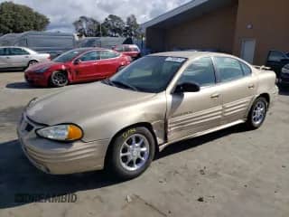 2001 Pontiac Grand Am SE z VIN 1G2NE52T91M583582, wystawiony jako Copart lot #77808974 z przebiegiem 126 219 mil mil oraz Szkoda całkowita • Salvage title. Historia ofert i sprzedaży dostępna na DreamBid. Obrazek 1.