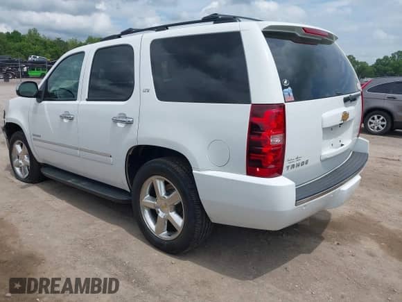 2012 Chevrolet Tahoe LTZ with VIN 1GNSKCE05CR177535, listed as a IAAI auction lot 42149054 with 184,830 mi miles and . Bid and sale history available at DreamBid. Image 3.