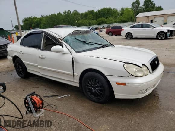 2004 Hyundai Sonata with VIN KMHWF25H74A041613, listed as a Copart auction lot 58448225 with 175,768 mi miles and Salvage title. Bid and sale history available at DreamBid. Image 4.