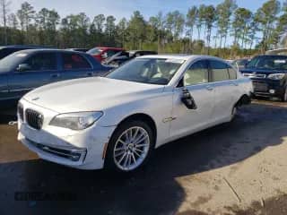 2013 BMW 7 Series 750i with VIN WBAYA8C55DC996693, listed as a Copart auction lot 80233423 with 140,925 mi miles and Salvage title. Bid and sale history available at DreamBid. Image 1.